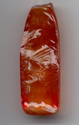 Boule of synthetic sapphire. Boules develop split upon cooling.