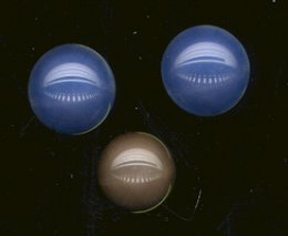 Synthetic sapphire cabochons.