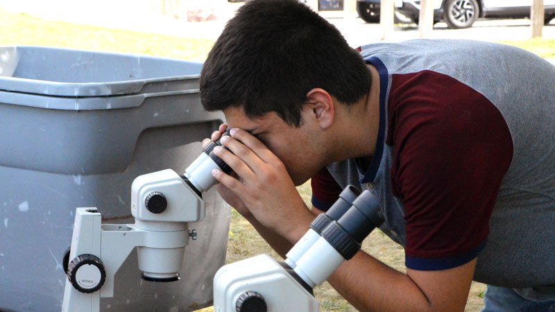 Student with Microscope 