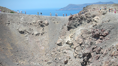 Treking along the Nea kameni volcano in Santorini-Greece