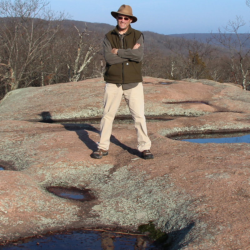 Examining tors and gnammas (panholes) on Proterozoic granite at Elephant Rocks, Missouri.