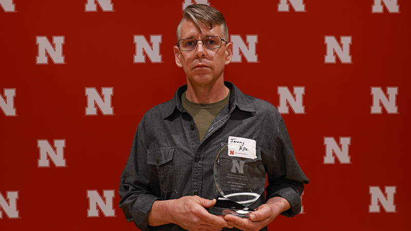 Jeremy Hiller with award at 2025 Spring banquet
