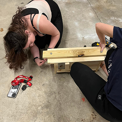 Students constructing squirrel houses