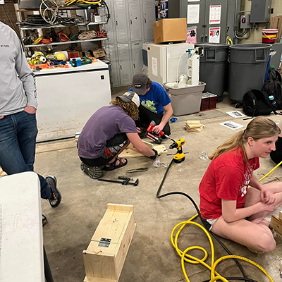 Students constructing squirrel houses