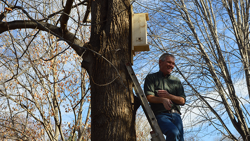 John Carrol with Nestbox near Hardin Hall