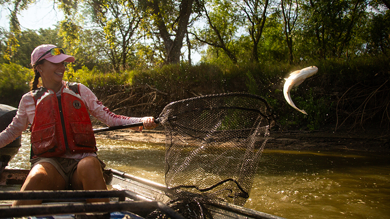 Student with Net as fish flys